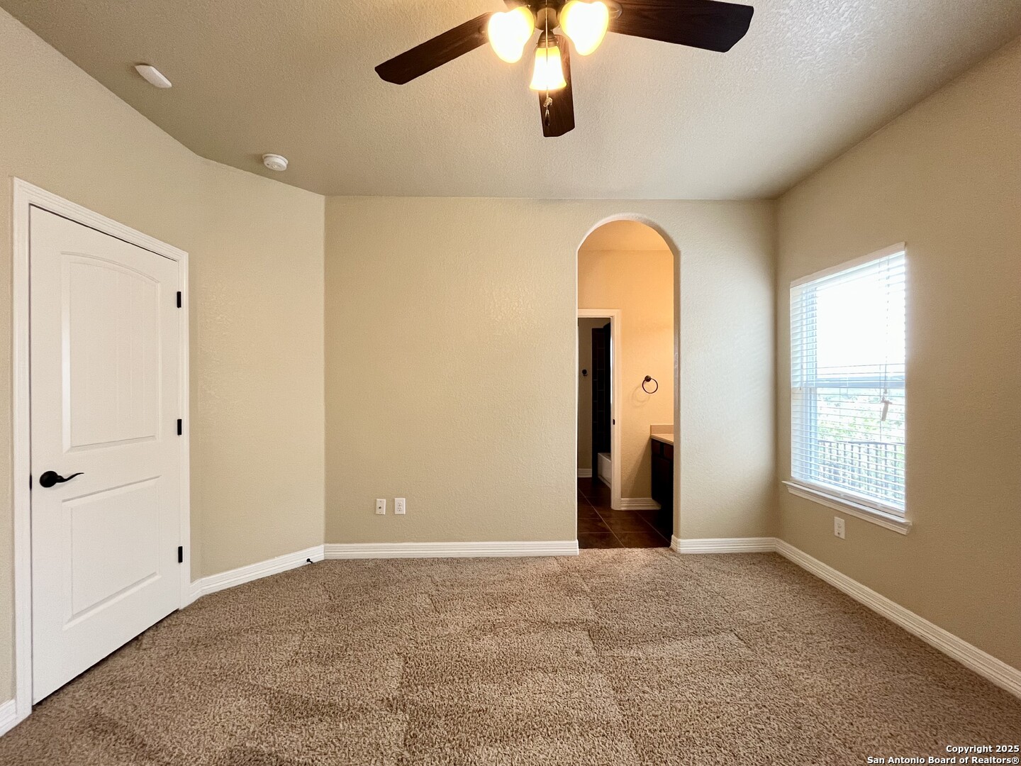 8123 Poconos Run San Antonio, TX 78255 - Photo 33 of 47 a view of a room with window ceiling fan and carpet