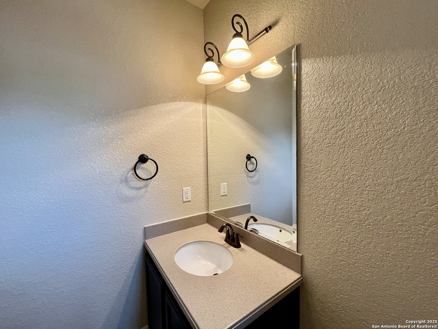 8123 Poconos Run San Antonio, TX 78255 - Photo 34 of 47 a bathroom with a sink and a mirror