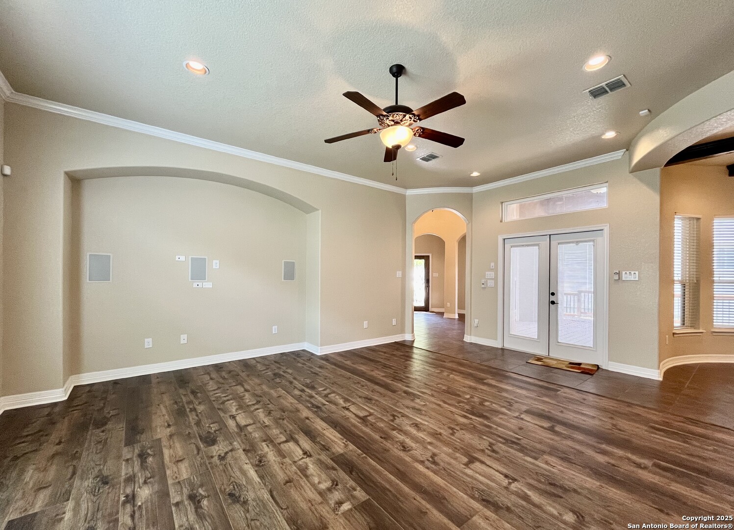 8123 Poconos Run San Antonio, TX 78255 - Photo 10 of 47 a view of an empty room with wooden floor and a window