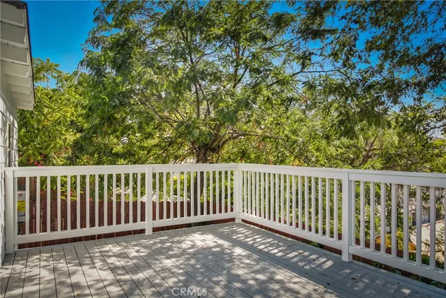 a view of a roof with wooden fence