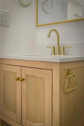 a bathroom with a sink and vanity