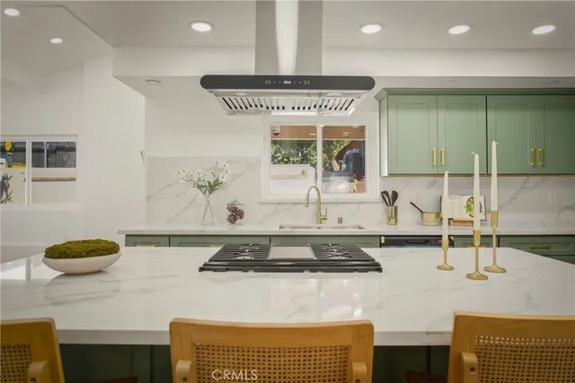 a kitchen with a sink and a stove