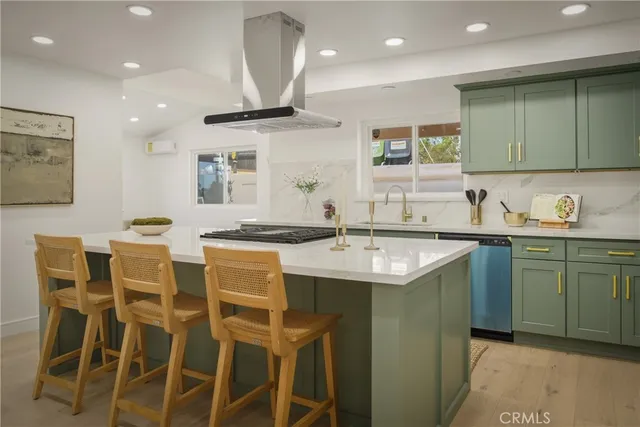 a kitchen with cabinets and sink