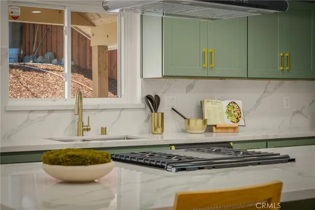 a kitchen with a stove and a cabinets
