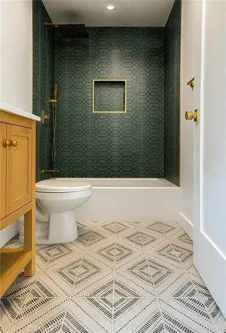 a bathroom with a toilet and a shower