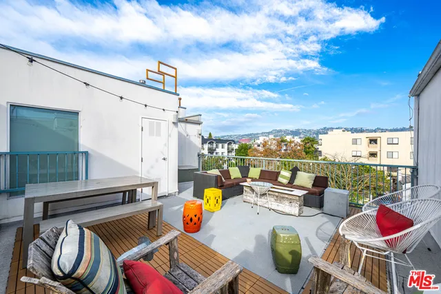 a view of a city with tall buildings and a yard