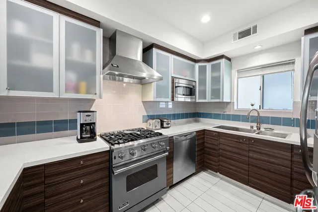 a kitchen with a stove and a sink