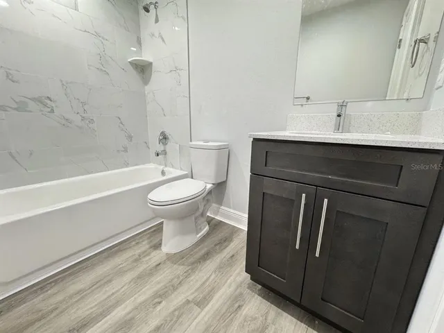 a bathroom with a sink a toilet and a bathtub