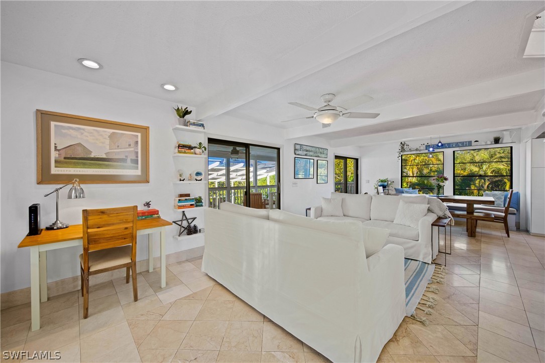 705 Rabbit Road Sanibel, FL 33957 - Photo 11 of 35 a living room with furniture and a large window