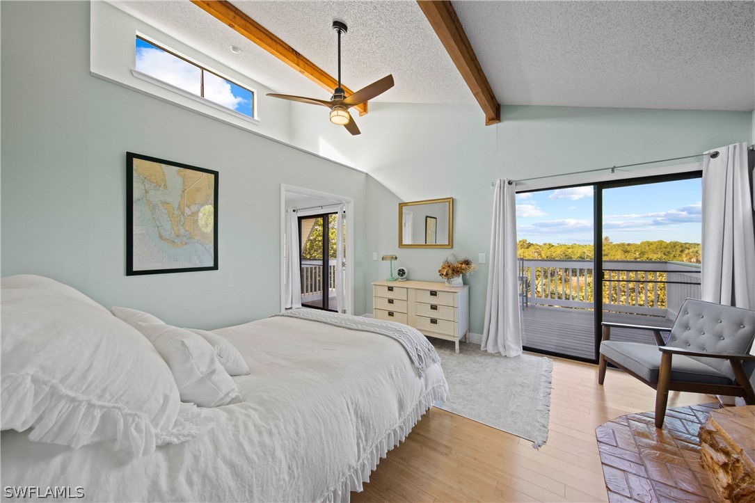 705 Rabbit Road Sanibel, FL 33957 - Photo 14 of 35 a bedroom with a bed and a large window