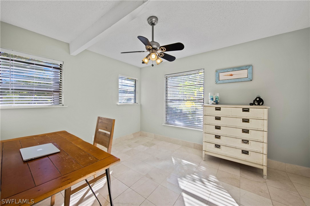 705 Rabbit Road Sanibel, FL 33957 - Photo 24 of 35 a view of a workspace with furniture and a window