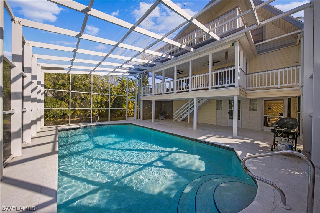 705 Rabbit Road Sanibel, FL 33957 - Photo 30 of 35 a view of a house with backyard