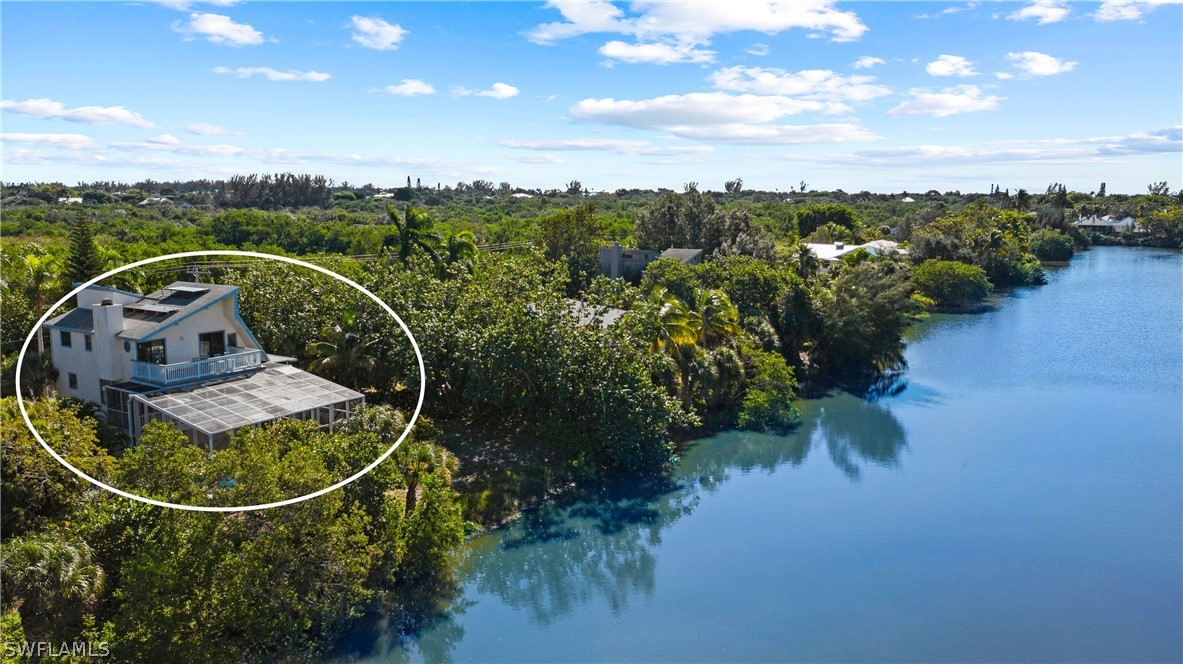 705 Rabbit Road Sanibel, FL 33957 - Photo 34 of 35 a view of a swimming pool with a garden