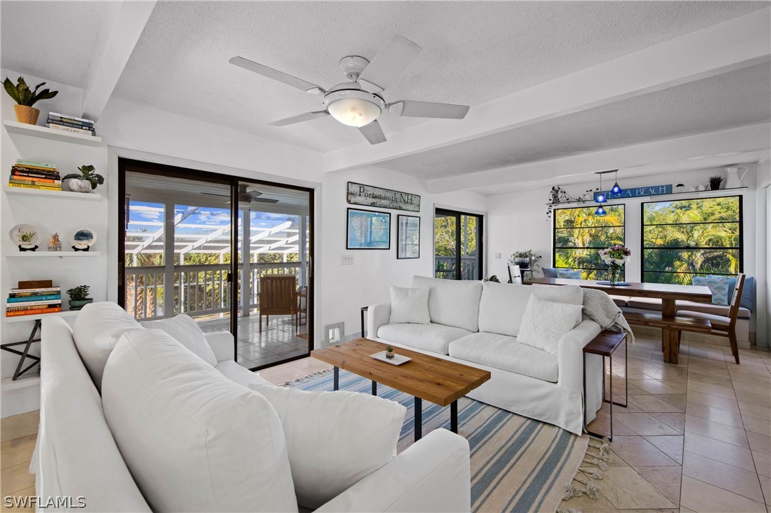 705 Rabbit Road Sanibel, FL 33957 - Photo 8 of 35 a living room with furniture and a window
