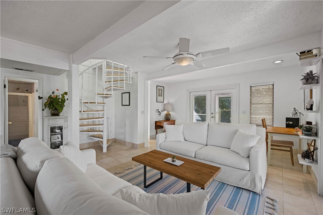 705 Rabbit Road Sanibel, FL 33957 - Photo 9 of 35 a living room with furniture and wooden floor