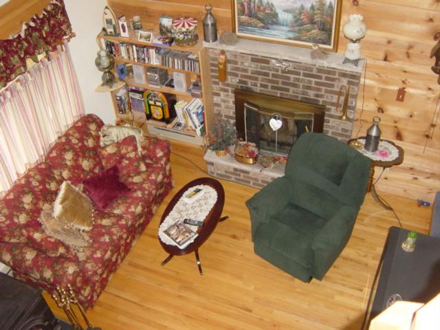 3118 Cotswald Road Tobyhanna, PA 18466 - Photo 5 of 8 a living room with furniture and a fireplace
