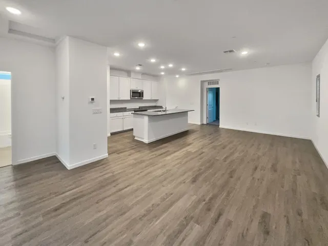 a view of kitchen with wooden floor