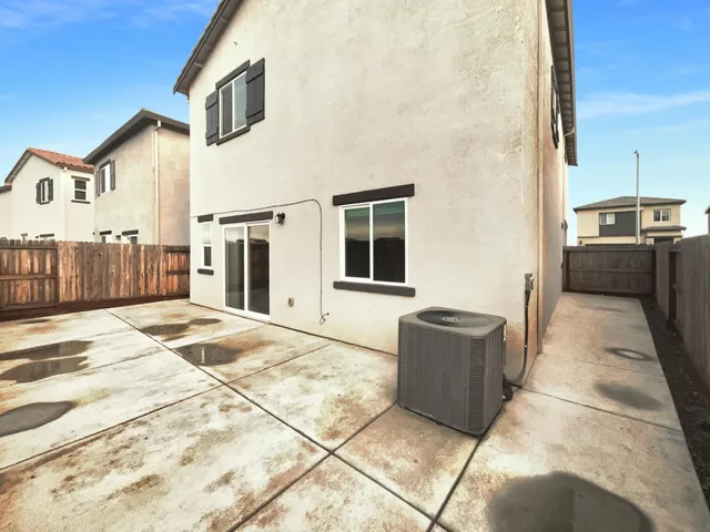 a living room with a couch and a stove top oven