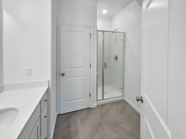 a bathroom with a shower and a tub