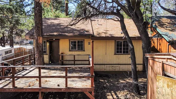 a view of a house with a tree