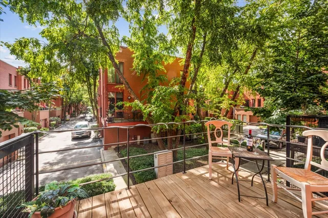 a view of a chairs and table on the wooden floor