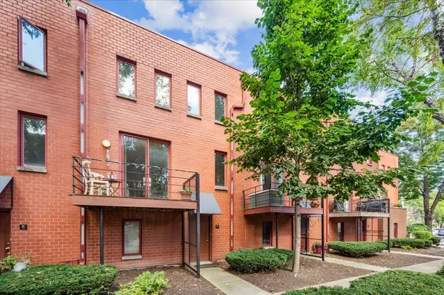 a front view of a building with garden
