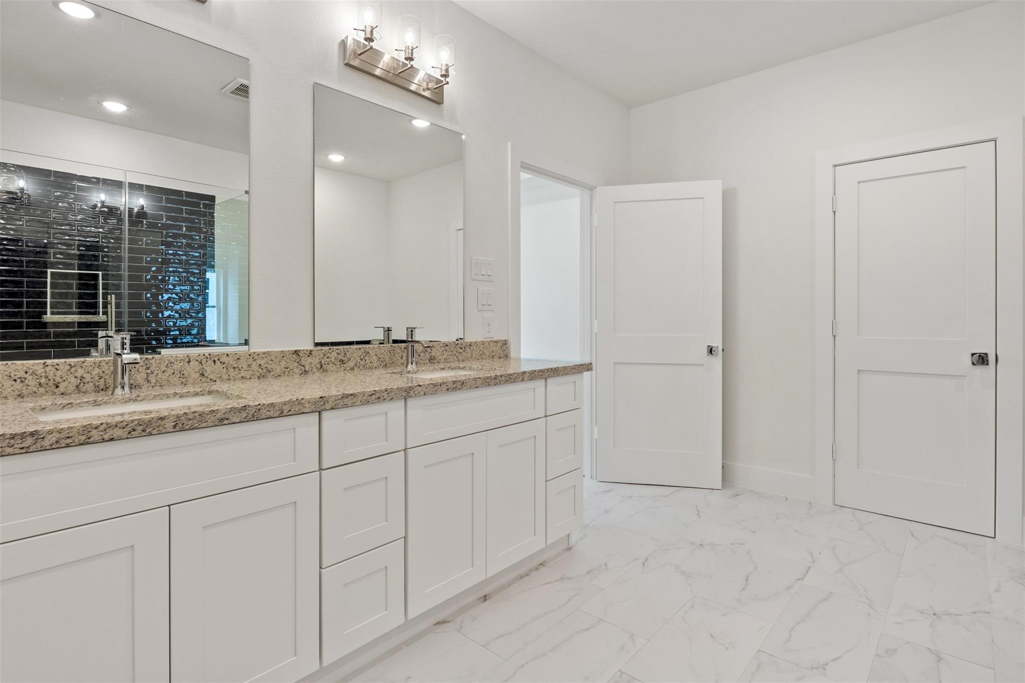 1928 Purswell Road Houston, TX 77055 - Photo 21 of 36 Double sinks, ample storage, and an abundance of natural light—oh my! At this price in this location, don't miss out on this opportunity!