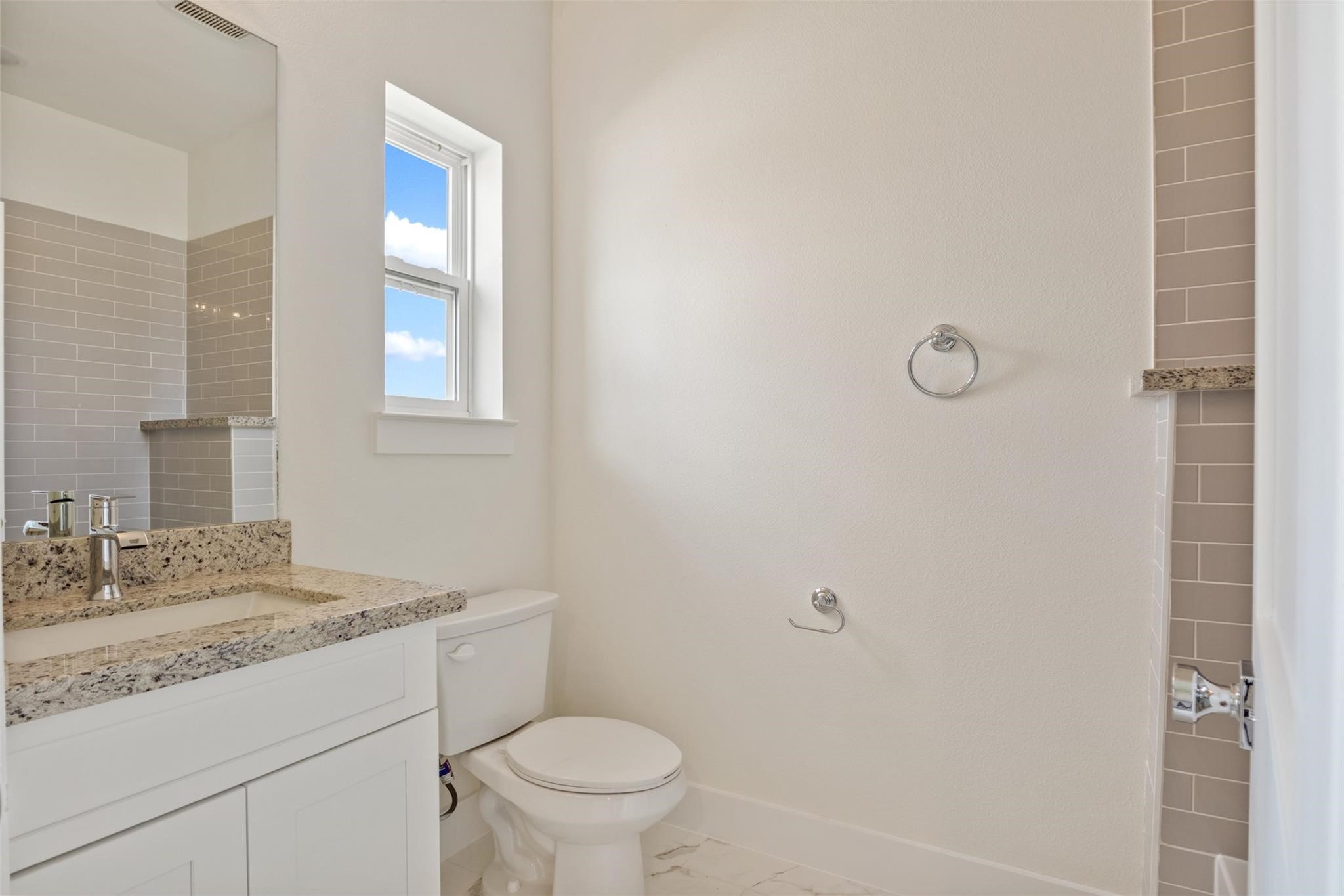 1928 Purswell Road Houston, TX 77055 - Photo 24 of 36 The secondary bathroom features abundant natural light and a convenient shower-tub combo!
