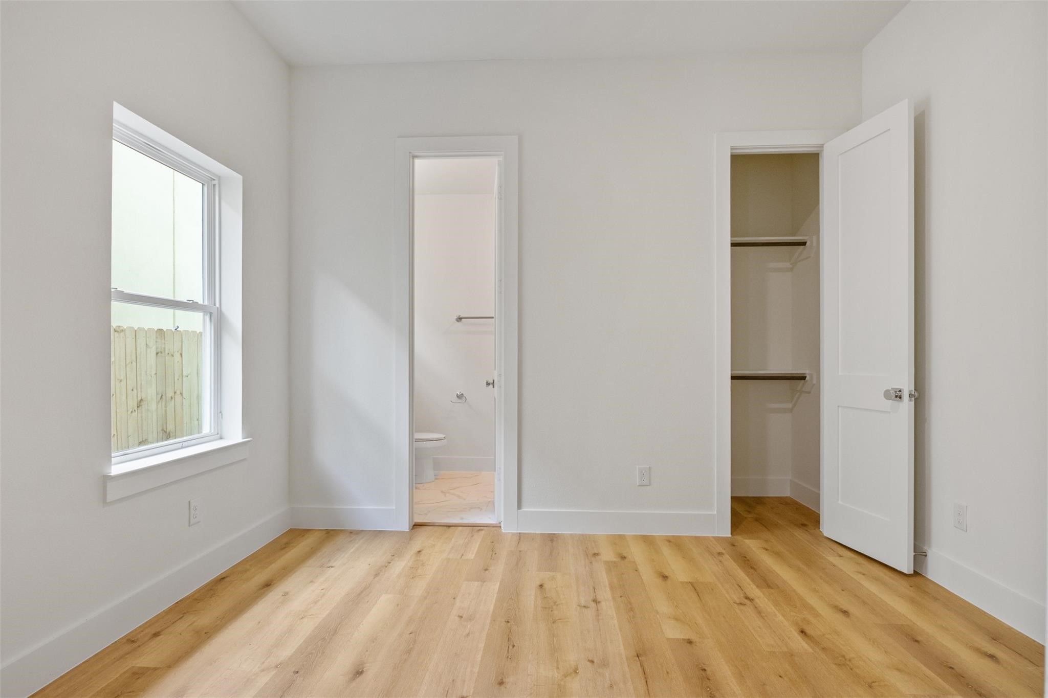 1928 Purswell Road Houston, TX 77055 - Photo 28 of 36 The secondary bedroom, located off the first floor, features hardwood floors, ample space, and is completely separated from the main house, creating its own little sanctuary.