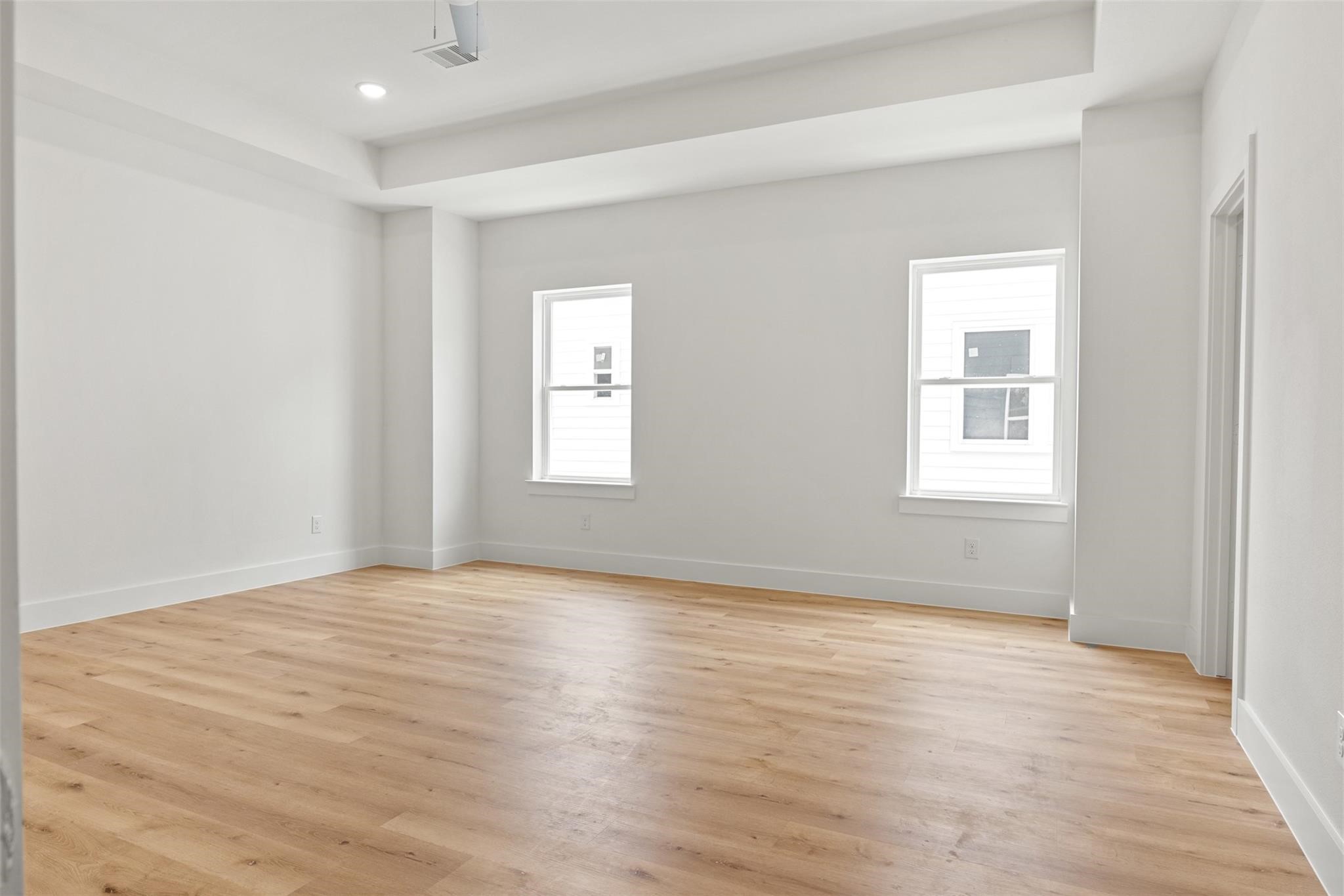 1928 Purswell Road Houston, TX 77055 - Photo 7 of 36 Enjoy the impressive scale of the living area, elevated by soaring 11-foot ceilings that enhance the sense of space and light.