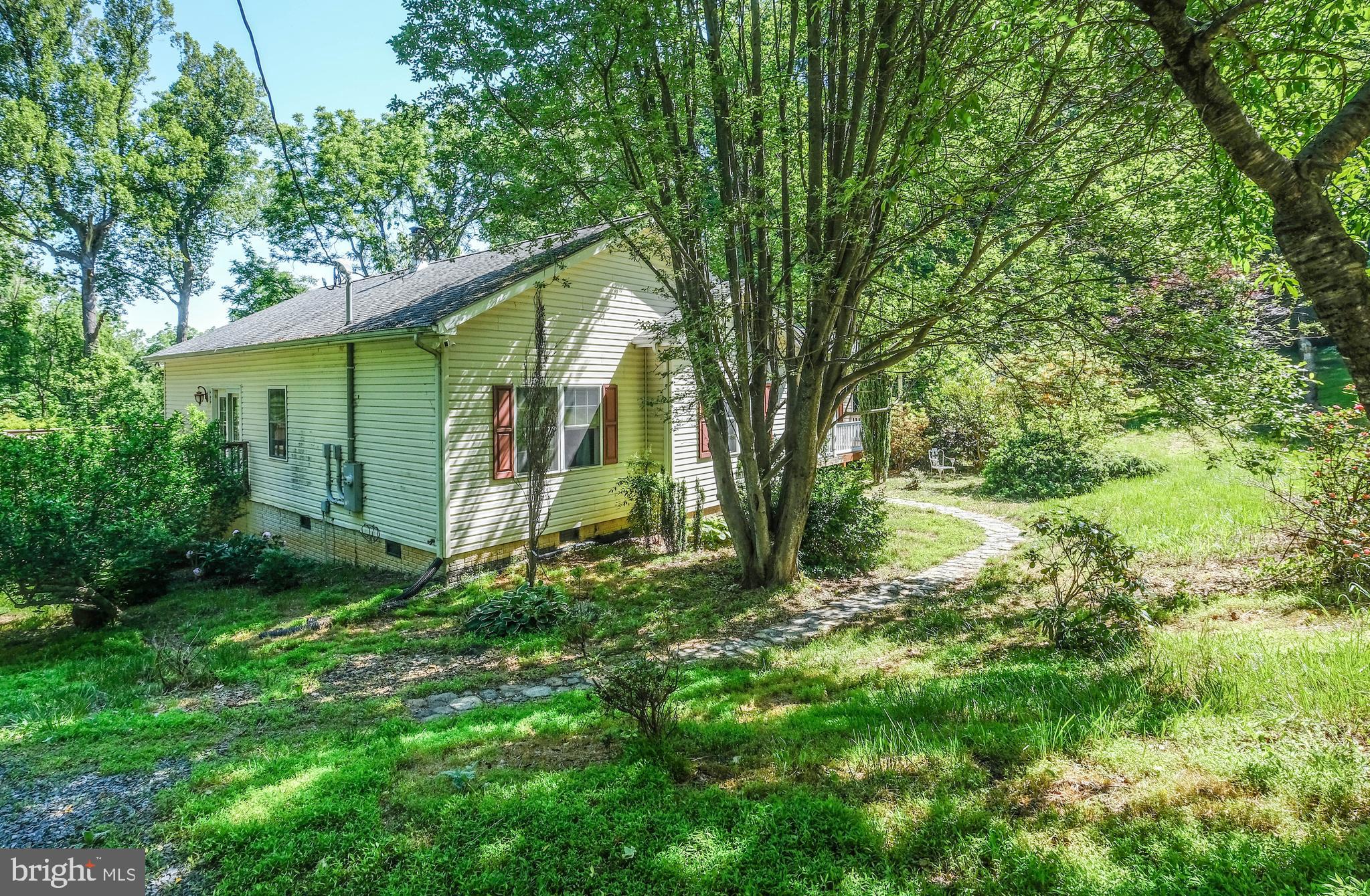1195 Shangri-La Road Bentonville, VA 22610 - Photo 64 of 64 a view of a house with a tree and a yard