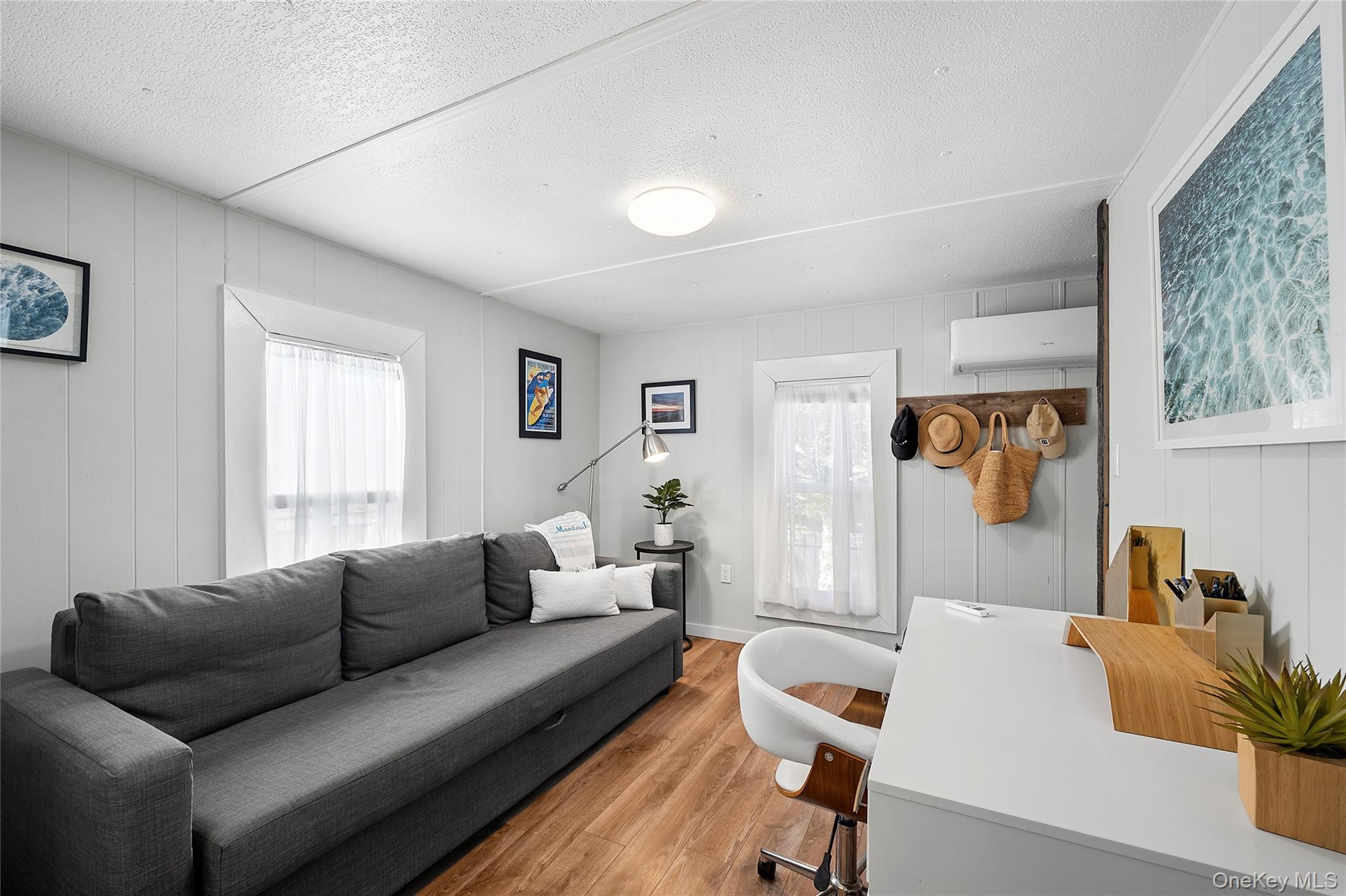 100 Deforest Road, Unit 433 Montauk, NY 11954 - Photo 10 of 26 a living room with furniture and a window