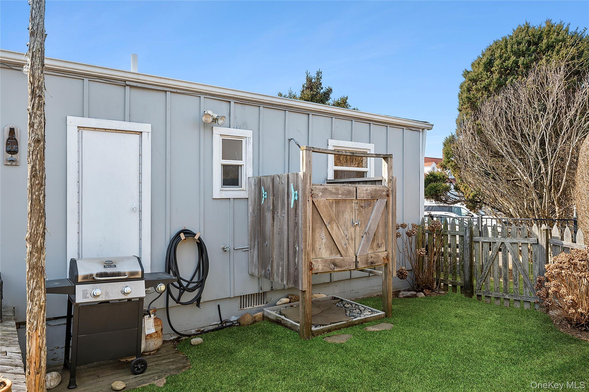 100 Deforest Road, Unit 433 Montauk, NY 11954 - Photo 14 of 26 a front view of a house with garden