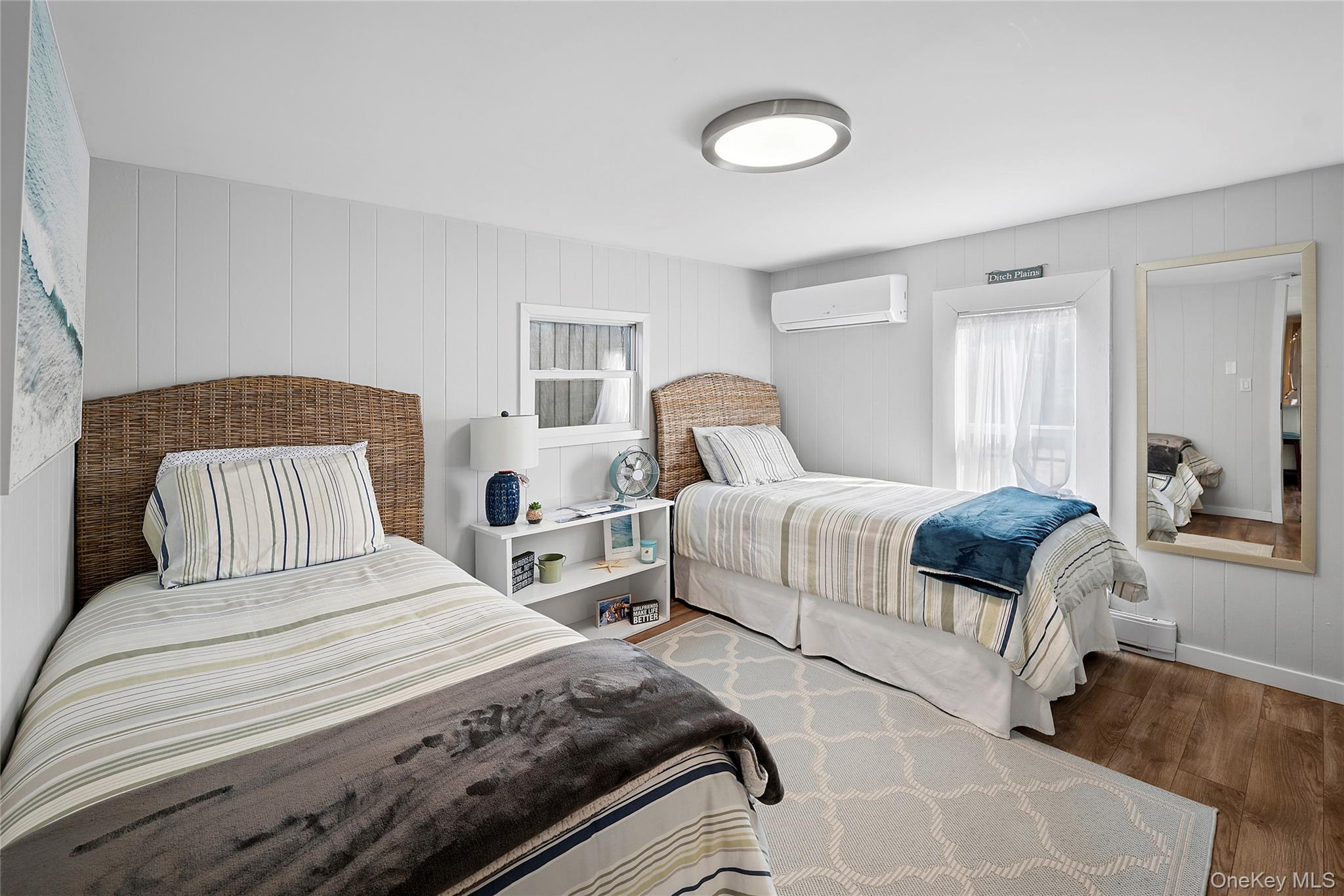 100 Deforest Road, Unit 433 Montauk, NY 11954 - Photo 8 of 26 a bedroom with a bed and a couch