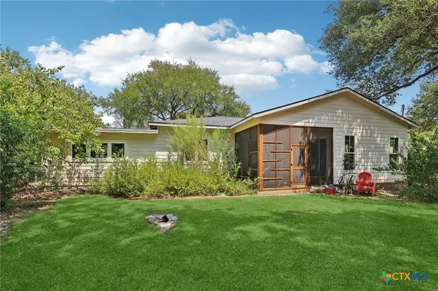 a backyard of a house with lots of green space
