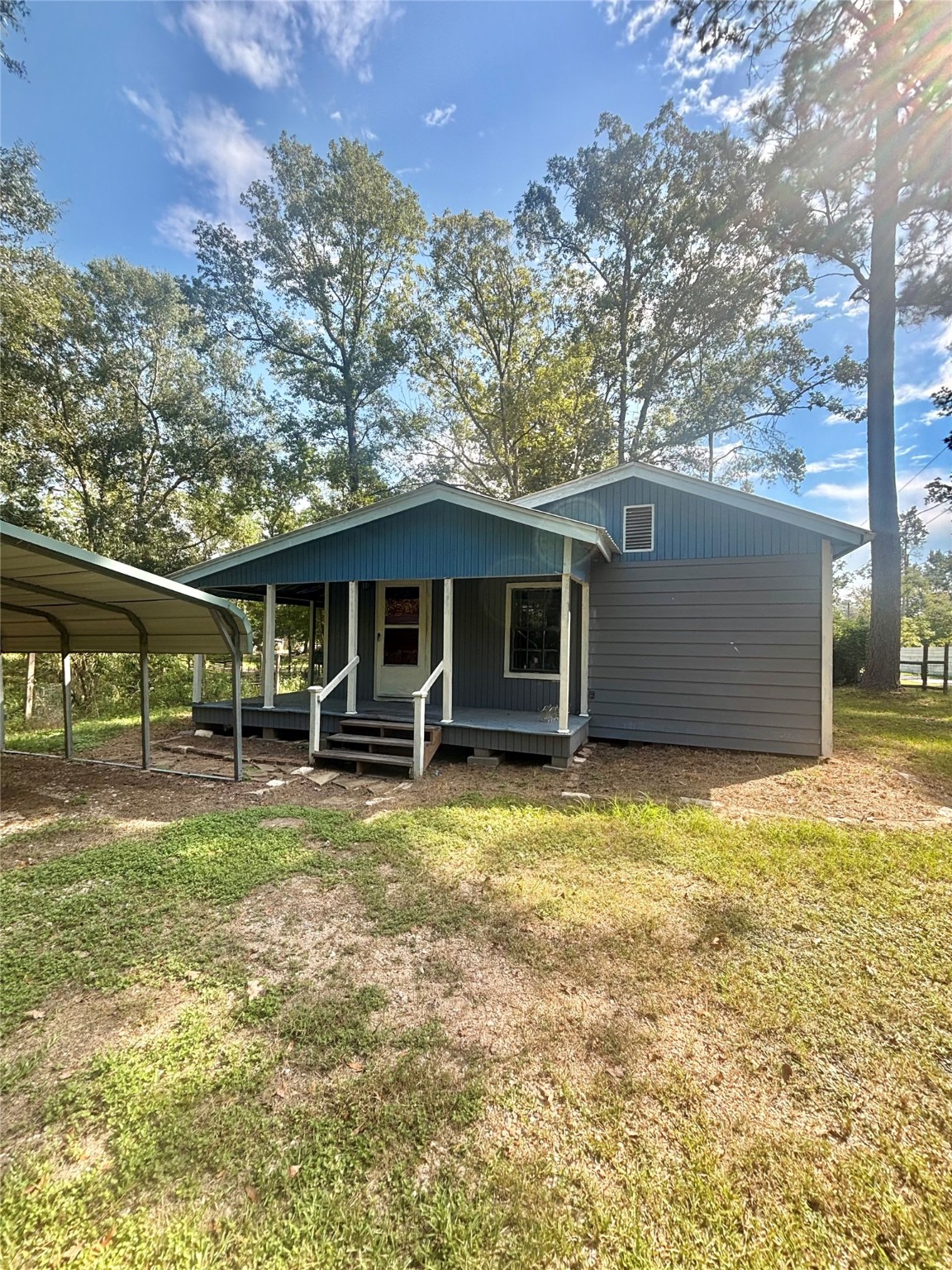 402 County Road 3708 Splendora, TX 77372 - Photo 1 of 11 a backyard of a house with table and chairs