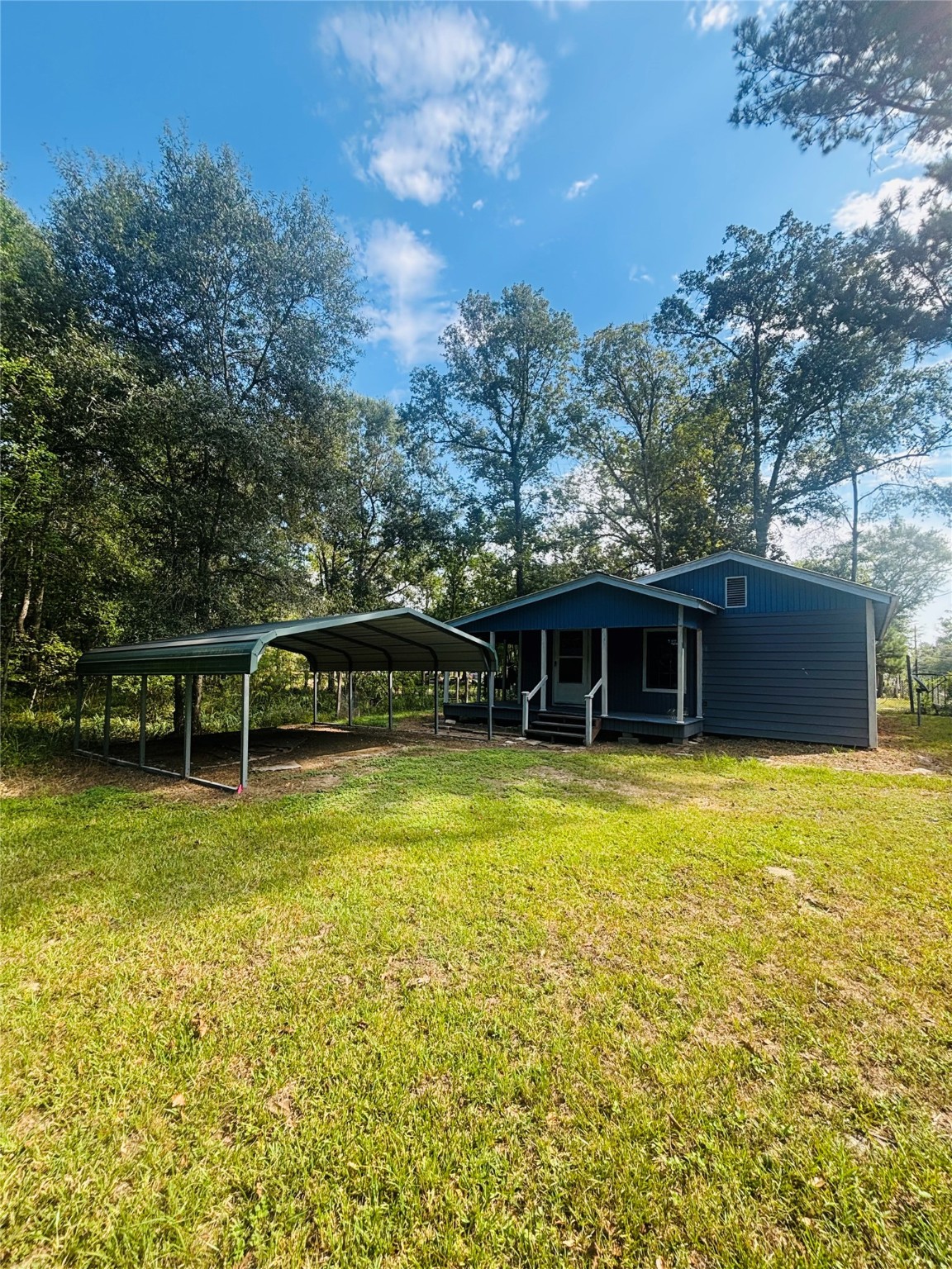 402 County Road 3708 Splendora, TX 77372 - Photo 2 of 11 a view of a swimming pool with a yard