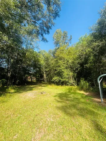 a view of a swimming pool with an outdoor space and seating area