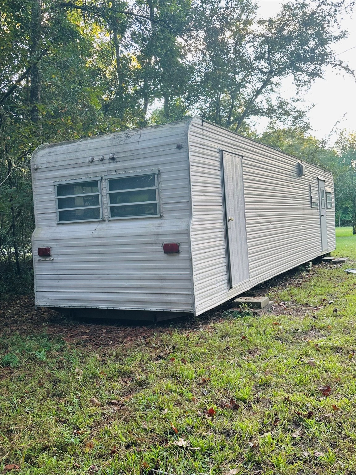 402 County Road 3708 Splendora, TX 77372 - Photo 10 of 11 a view of a house with a yard