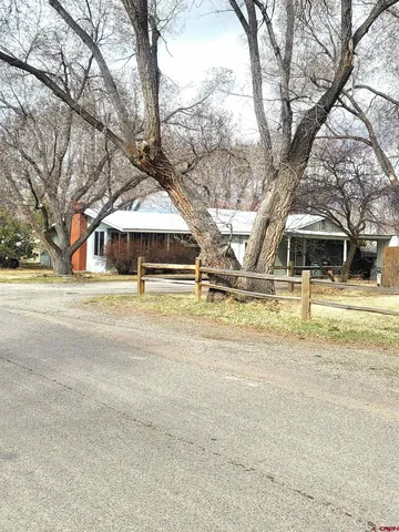 a swimming pool with outdoor seating and yard