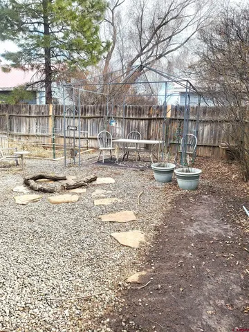 a view of outdoor space with garden and seating