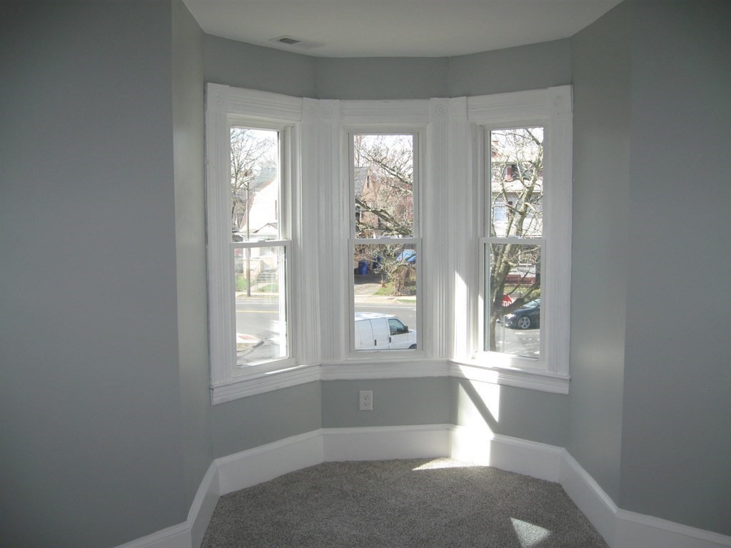 12 Alderman Street Springfield, MA 01108 - Photo 18 of 27 a living room with furniture and windows