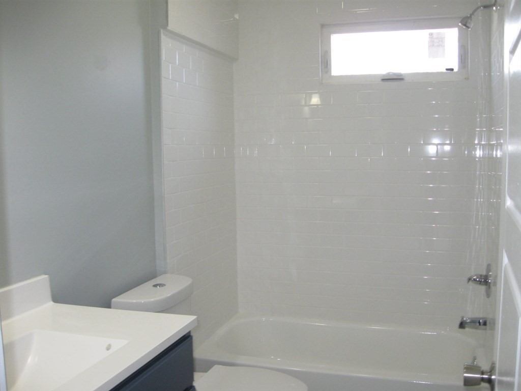 12 Alderman Street Springfield, MA 01108 - Photo 20 of 27 a bathroom with a bathtub and shower