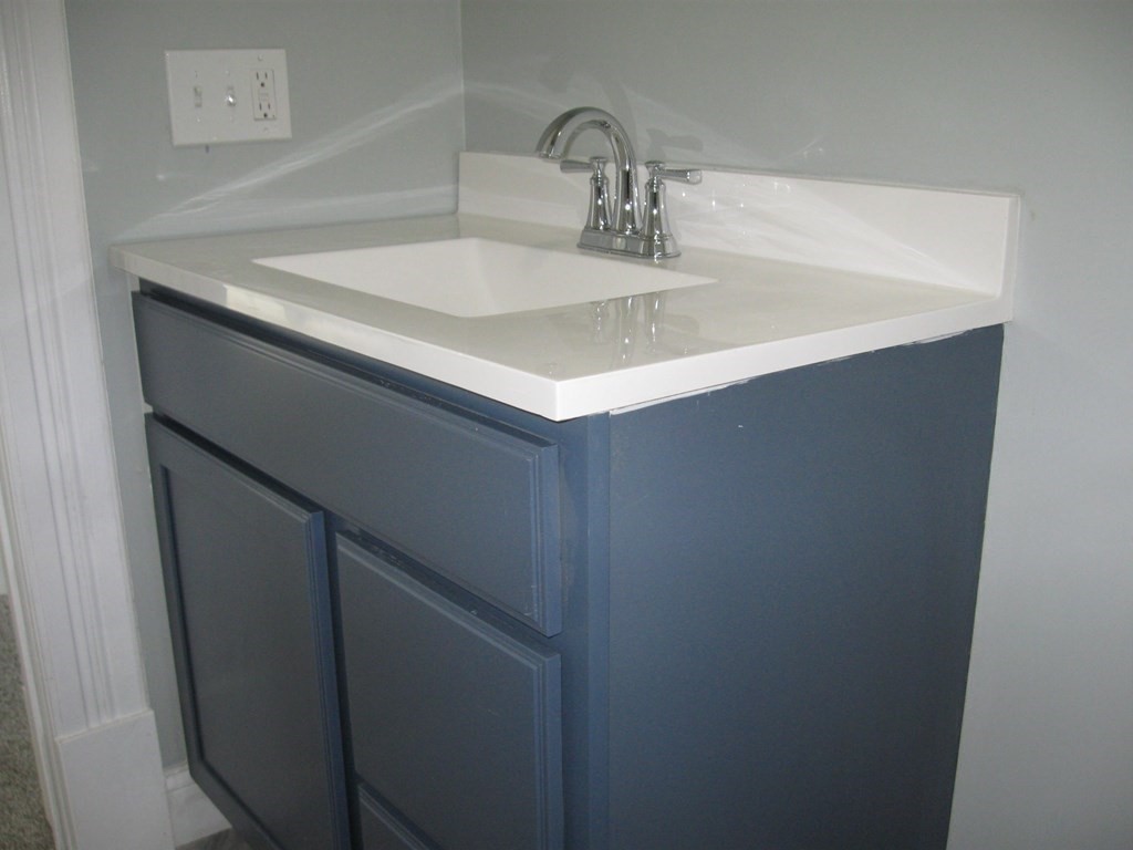 12 Alderman Street Springfield, MA 01108 - Photo 21 of 27 a bathroom with a sink and a mirror