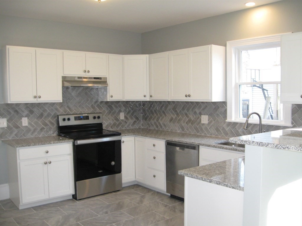 12 Alderman Street Springfield, MA 01108 - Photo 8 of 27 a kitchen with cabinets appliances and a sink