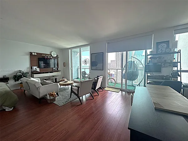 a view of a balcony with wooden floor and fence