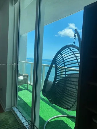 a large kitchen with a table and chairs