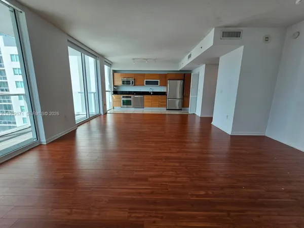 a view of a livingroom with wooden floor