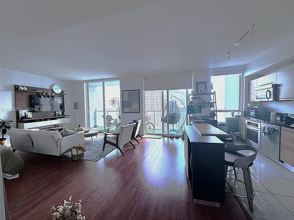 a living room with furniture fireplace and a flat screen tv