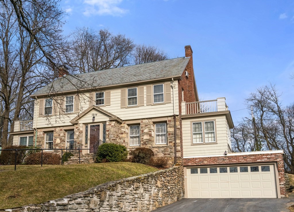 a front view of a house with garden